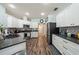 Modern kitchen with stainless steel appliances, granite countertops, and ample cabinet space for storage at 1447 Stetson Dr, Wesley Chapel, FL 33543