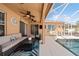 Inviting outdoor patio with comfortable seating and a view of the pool at 1447 Stetson Dr, Wesley Chapel, FL 33543