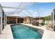This home features a beautiful screened-in pool and outdoor seating area, perfect for relaxing and entertaining at 1447 Stetson Dr, Wesley Chapel, FL 33543