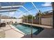 Sparkling pool with a screened enclosure, offering privacy and a refreshing oasis at 1447 Stetson Dr, Wesley Chapel, FL 33543