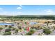 Gorgeous aerial view of the home with lakes, golf course, and surrounding community at 1530 Ingram Dr # 1530, Sun City Center, FL 33573