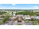 Beautiful aerial view of the clubhouse with a lake, golf course, and tropical landscaping at 1530 Ingram Dr # 1530, Sun City Center, FL 33573