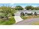 Charming one-story home with attached garage, landscaped front yard and mature trees at 1530 Ingram Dr # 1530, Sun City Center, FL 33573