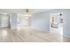 Bright living room with hardwood floors, ceiling fans, and natural light, showcasing a welcoming atmosphere at 1530 Ingram Dr # 1530, Sun City Center, FL 33573