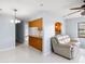 Open-concept living space connecting to kitchen with updated flooring and natural light, great for entertaining at 1530 Ingram Dr # 1530, Sun City Center, FL 33573