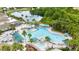 Fantastic aerial view of the community pool, palm trees, and ample seating at 1530 Ingram Dr # 1530, Sun City Center, FL 33573
