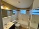 Clean bathroom featuring a bathtub with shower, and a nice sink vanity with mirror at 1542 Derrick St, Holiday, FL 34690