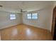 Bright bedroom with natural light, laminate wood floors, and windows at 1542 Derrick St, Holiday, FL 34690