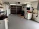 An attached garage equipped with a washer and dryer unit at 1542 Derrick St, Holiday, FL 34690