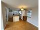 Well-lit kitchen featuring laminate wood floors and lots of cabinet storage space at 1542 Derrick St, Holiday, FL 34690