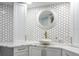 Stylish bathroom features a modern sink, decorative mirror, and gold fixtures at 1600 Gulf Blvd # 1112, Clearwater Beach, FL 33767