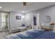 Comfortable bedroom featuring a contemporary couch, balcony access, and closet at 1600 Gulf Blvd # 1112, Clearwater Beach, FL 33767