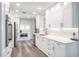 Modern kitchen features white cabinets, stainless steel appliances, and stylish backsplash at 1600 Gulf Blvd # 1112, Clearwater Beach, FL 33767