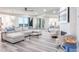 Bright living room featuring modern furniture, stylish decor, and floor-to-ceiling mirrors at 1600 Gulf Blvd # 1112, Clearwater Beach, FL 33767