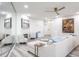 Open concept living area with a fireplace, modern art, and cozy furniture at 1600 Gulf Blvd # 1112, Clearwater Beach, FL 33767