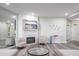 Contemporary living area highlighting a fireplace, modern art, and neutral-toned furnishings at 1600 Gulf Blvd # 1112, Clearwater Beach, FL 33767