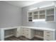 Bright home office featuring built-in desk, cabinetry and shelving with modern fixtures and light gray walls at 1600 Gulf Blvd # 1112, Clearwater Beach, FL 33767