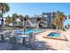 Community pool area with chairs and tables at 1600 Gulf Blvd # 1112, Clearwater Beach, FL 33767