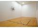 Community racquetball court featuring hardwood floors and a new basketball hoop at 1600 Gulf Blvd # 1112, Clearwater Beach, FL 33767