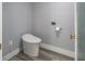 Modern toilet and gold fixtures complement sleek gray walls and luxury vinyl plank flooring at 1600 Gulf Blvd # 1112, Clearwater Beach, FL 33767