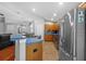Traditional style kitchen with wood cabinets, stainless appliances, and eat in bar at 18631 Le Dauphine Pl, Lutz, FL 33558