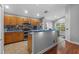 Traditional kitchen with stainless steel appliances, wooden cabinets, and blue countertops at 18631 Le Dauphine Pl, Lutz, FL 33558
