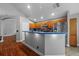 Traditional style kitchen features wooden cabinets, stainless steel appliances and blue countertops at 18631 Le Dauphine Pl, Lutz, FL 33558