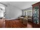 Bright living room with a cozy sectional sofa, wood floors, and natural light at 18631 Le Dauphine Pl, Lutz, FL 33558