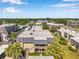 Aerial view of a residential community with lush landscaping and well-maintained buildings at 2003 Cordova Grn, Seminole, FL 33777