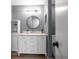 Bathroom boasts a marble countertop, modern vanity, and ample storage creating a clean and organized space at 2003 Cordova Grn, Seminole, FL 33777