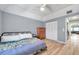 Bedroom features hardwood floors, a comfortable bed, and a closet offering ample storage space at 2003 Cordova Grn, Seminole, FL 33777