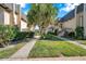 Inviting condominium community with manicured lawns and well-maintained sidewalks at 2003 Cordova Grn, Seminole, FL 33777