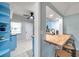 Bright kitchen featuring butcher block countertops, updated stainless sink and fixtures, and an eat-in counter with stools at 2003 Cordova Grn, Seminole, FL 33777