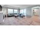 Bright living room featuring a fireplace, lots of windows, and modern decor at 2003 Cordova Grn, Seminole, FL 33777