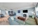 Open living room with a fireplace, large comfortable sofa, and modern decor at 2003 Cordova Grn, Seminole, FL 33777