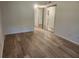 Spacious bedroom with wood-look floors and mirrored closet doors, providing ample storage at 2293 Swedish Dr # 11, Clearwater, FL 33763