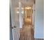 Hallway featuring hard surface floors with multiple entrances to other rooms at 2293 Swedish Dr # 11, Clearwater, FL 33763