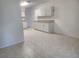 Bright kitchen featuring tile floors, ample counter space, and white cabinets at 2293 Swedish Dr # 11, Clearwater, FL 33763
