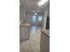 Bright kitchen featuring tile floors, ample counter space, and white cabinets at 2293 Swedish Dr # 11, Clearwater, FL 33763