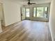 Living room featuring modern flooring, natural light and an open doorway at 2293 Swedish Dr # 11, Clearwater, FL 33763