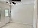 Living room featuring tile floors and a ceiling fan at 2293 Swedish Dr # 11, Clearwater, FL 33763