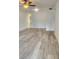 Spacious living room featuring modern flooring, ceiling fan and neutral paint at 2293 Swedish Dr # 11, Clearwater, FL 33763