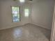 Living room featuring tile floors, ceiling fan, and access to patio at 2293 Swedish Dr # 11, Clearwater, FL 33763
