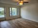 Bright living room featuring modern flooring, neutral paint, and natural light at 2293 Swedish Dr # 11, Clearwater, FL 33763