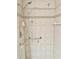 Shower stall with handheld showerhead, grab bars, and tiled walls at 2293 Swedish Dr # 11, Clearwater, FL 33763