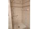 Shower stall features grab bars and handheld showerhead for accessibility at 2293 Swedish Dr # 11, Clearwater, FL 33763