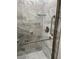 Updated shower featuring marble-look tile, glass door and grab bars for accessibility and safety at 2293 Swedish Dr # 11, Clearwater, FL 33763