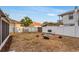 Spacious backyard features a fire pit, a grill, and a white privacy fence for outdoor enjoyment at 2916 W Crest Ave, Tampa, FL 33614