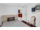 Light bedroom with sleek hardwood floors, open doorway and neutral paint at 2916 W Crest Ave, Tampa, FL 33614