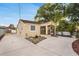 Well-maintained home with a spacious driveway and neat landscaping, showcasing its curb appeal at 2916 W Crest Ave, Tampa, FL 33614